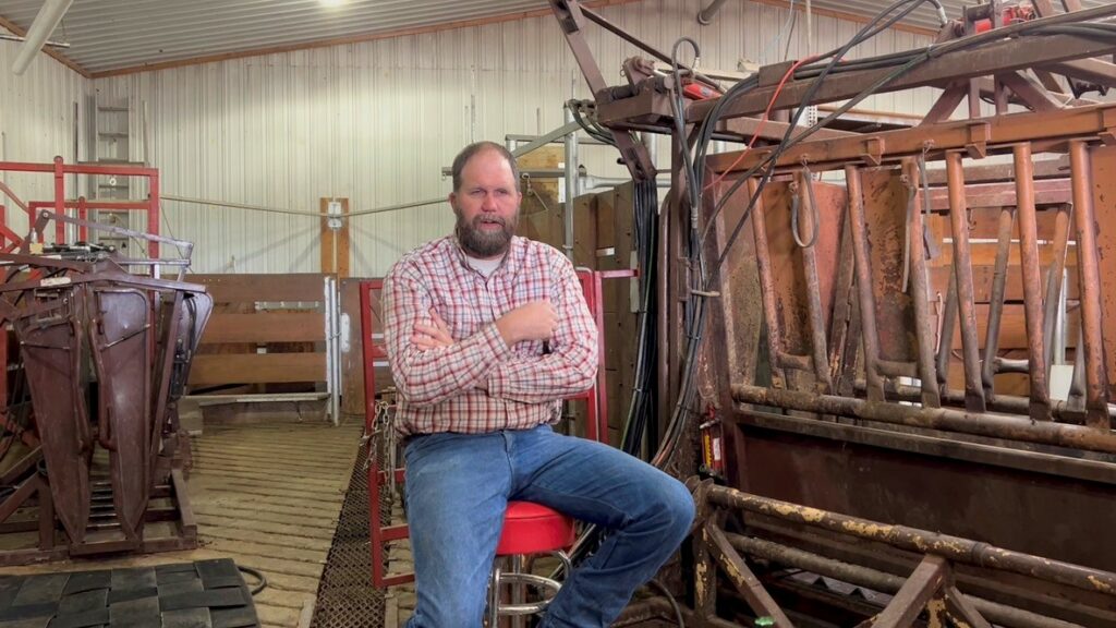 Eric Knock sitting by the cattle shoot.